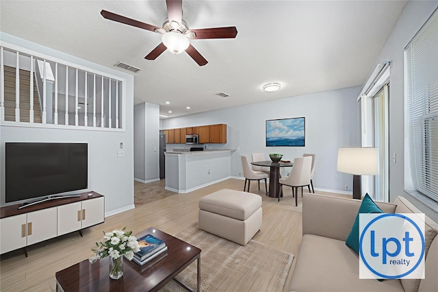 8118 Stone Path Way, Tampa, FL 33647 - living area featuring light wood-style flooring, a ceiling fan, and recessed lighting