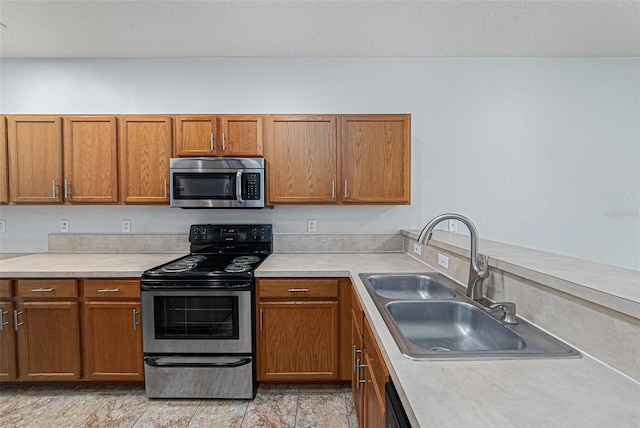 8118 Stone Path Way, Tampa, FL 33647 - kitchen featuring stainless steel microwave, electric range, light countertops, and brown cabinets