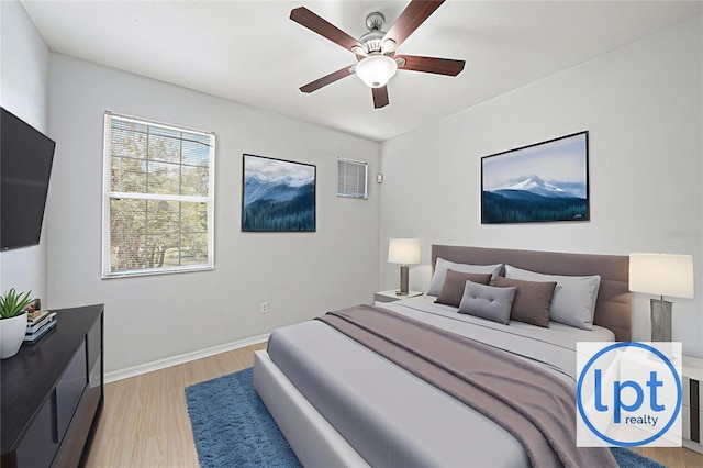 8118 Stone Path Way, Tampa, FL 33647 - bedroom with light wood-type flooring and a ceiling fan
