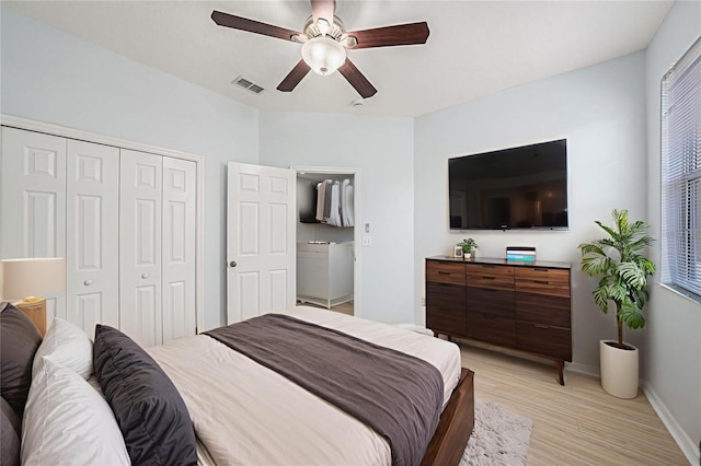 8118 Stone Path Way, Tampa, FL 33647 - bedroom featuring a closet, light wood-style floors, and a ceiling fan