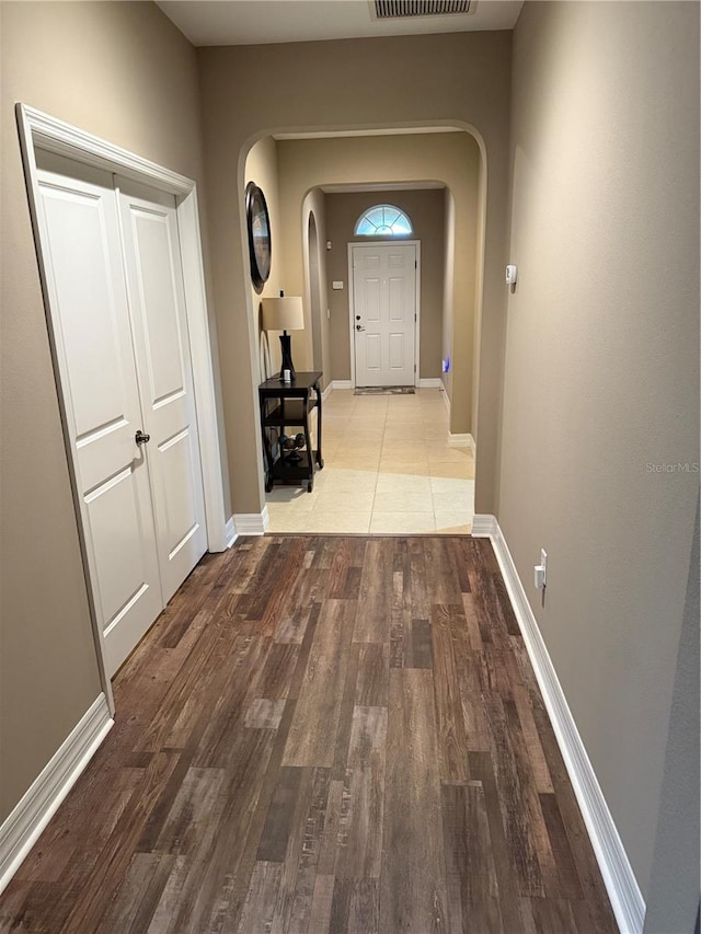 4432 Vermillion Sky Dr, Wesley Chapel, FL 33544 - hall featuring arched walkways and wood finished floors