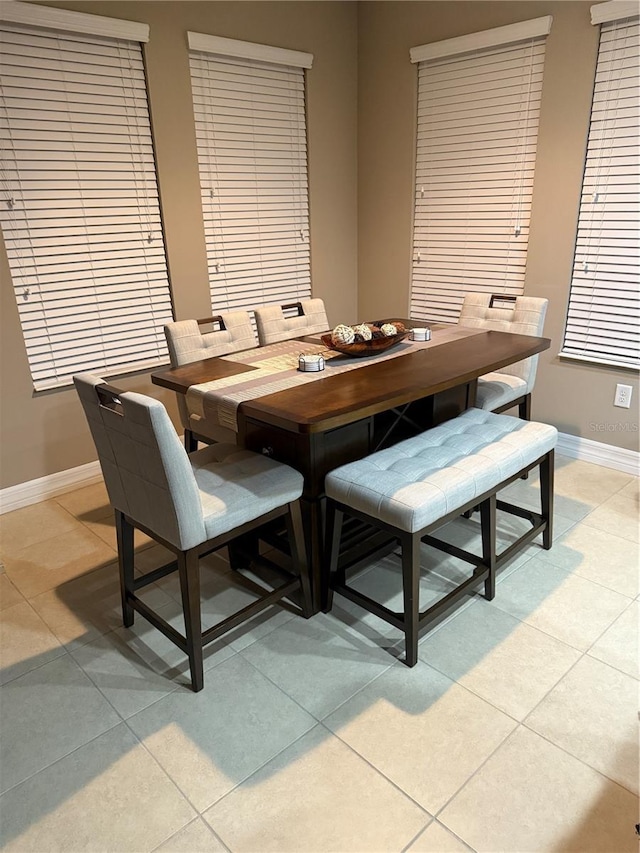 4432 Vermillion Sky Dr, Wesley Chapel, FL 33544 - dining area featuring light tile patterned floors and baseboards
