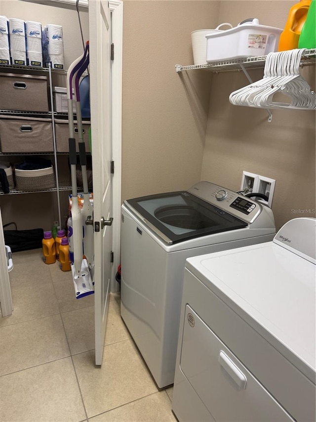 4432 Vermillion Sky Dr, Wesley Chapel, FL 33544 - laundry room with separate washer and dryer and light tile patterned floors