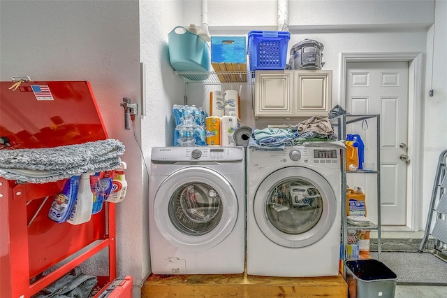 13425 San Rafael Dr, Largo, FL 33774 - washroom featuring washer and clothes dryer, cabinet space, and a textured wall