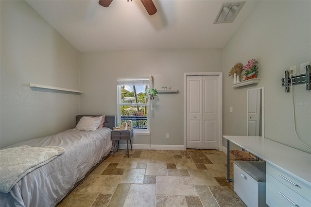 13425 San Rafael Dr, Largo, FL 33774 - bedroom featuring stone tile floors, a closet, and ceiling fan