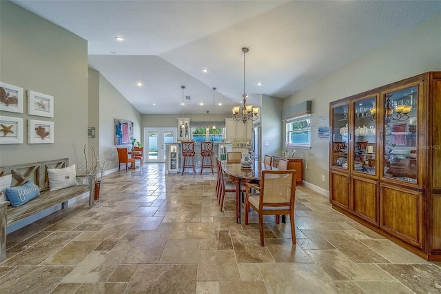 13425 San Rafael Dr, Largo, FL 33774 - dining area with stone tile floors, a chandelier, high vaulted ceiling, and recessed lighting