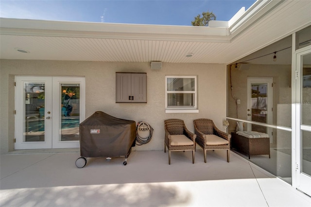 13425 San Rafael Dr, Largo, FL 33774 - view of patio / terrace with french doors and a grill