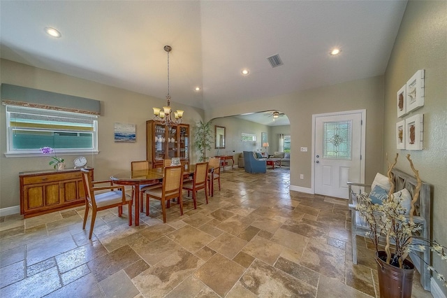 13425 San Rafael Dr, Largo, FL 33774 - dining space featuring stone tile floors, healthy amount of natural light, a chandelier, recessed lighting, and arched walkways