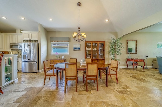 13425 San Rafael Dr, Largo, FL 33774 - dining room with stone tile floors, a chandelier, lofted ceiling, and recessed lighting