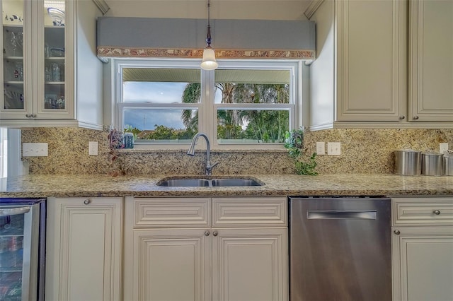 13425 San Rafael Dr, Largo, FL 33774 - kitchen featuring stainless steel dishwasher, wine cooler, glass insert cabinets, decorative backsplash, and light stone counters