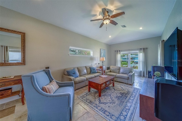 13425 San Rafael Dr, Largo, FL 33774 - living area with ceiling fan, vaulted ceiling, and stone tile flooring