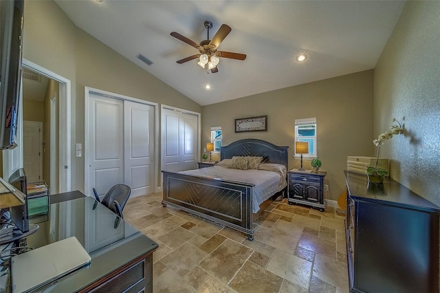 13425 San Rafael Dr, Largo, FL 33774 - bedroom with multiple closets, lofted ceiling, stone tile floors, a ceiling fan, and recessed lighting