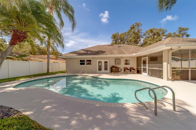 13425 San Rafael Dr, Largo, FL 33774 - view of pool featuring french doors, a patio area, and a sunroom