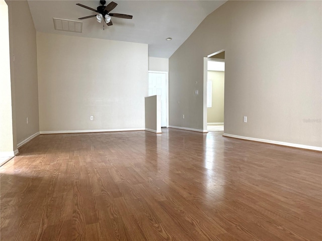1235 Alpine Lake Dr, Brandon, FL 33511 - unfurnished living room featuring vaulted ceiling, a ceiling fan, and dark wood finished floors
