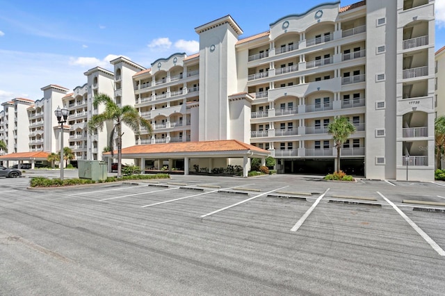 17735 Gulf Blvd Unit 502, Redington Shores, FL 33708 - view of apartment building / complex featuring uncovered parking