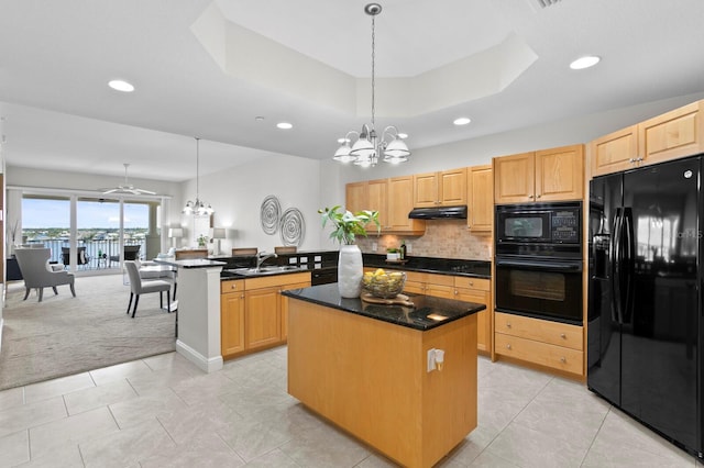 17735 Gulf Blvd Unit 502, Redington Shores, FL 33708 - kitchen featuring black appliances, a chandelier, under cabinet range hood, a kitchen island, and recessed lighting