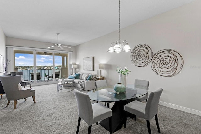 17735 Gulf Blvd Unit 502, Redington Shores, FL 33708 - dining room featuring carpet flooring, a chandelier, and a ceiling fan