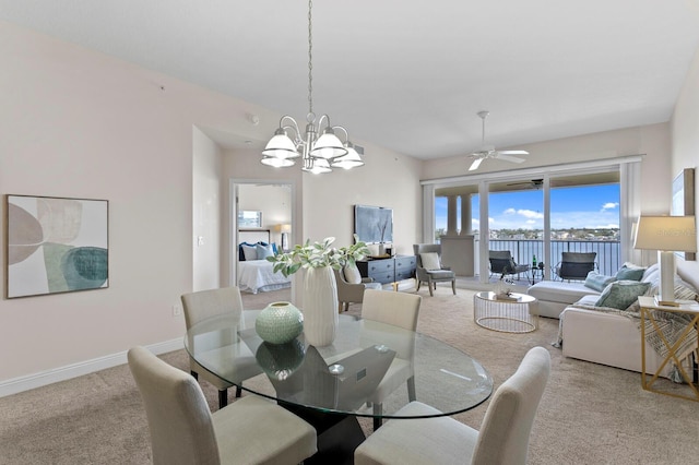 17735 Gulf Blvd Unit 502, Redington Shores, FL 33708 - carpeted dining room featuring a ceiling fan and a chandelier