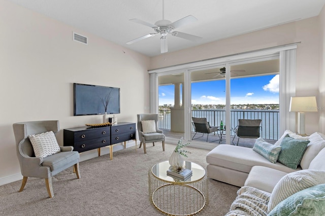 17735 Gulf Blvd Unit 502, Redington Shores, FL 33708 - carpeted living area featuring ceiling fan and baseboards