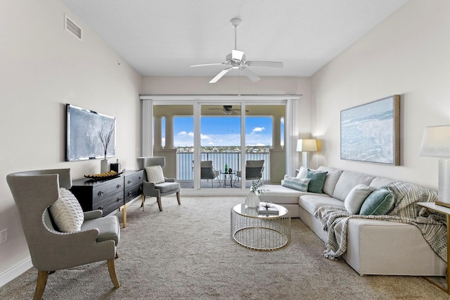 17735 Gulf Blvd Unit 502, Redington Shores, FL 33708 - living room featuring a ceiling fan and carpet floors