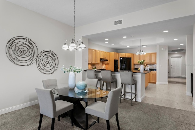 17735 Gulf Blvd Unit 502, Redington Shores, FL 33708 - dining area with a chandelier, light colored carpet, recessed lighting, and light tile patterned flooring