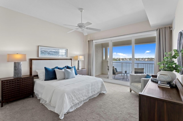 17735 Gulf Blvd Unit 502, Redington Shores, FL 33708 - bedroom featuring access to outside, light carpet, a water view, and a ceiling fan