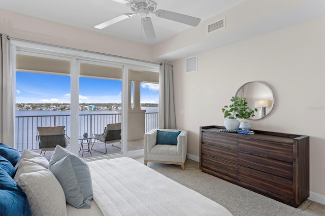 17735 Gulf Blvd Unit 502, Redington Shores, FL 33708 - carpeted bedroom with access to exterior, a water view, and a ceiling fan