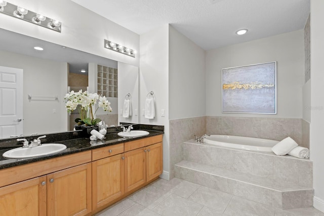 17735 Gulf Blvd Unit 502, Redington Shores, FL 33708 - bathroom with tile patterned floors, a garden tub, double vanity, and recessed lighting