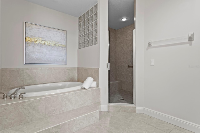 17735 Gulf Blvd Unit 502, Redington Shores, FL 33708 - bathroom with a bath, tile patterned flooring, and a shower stall