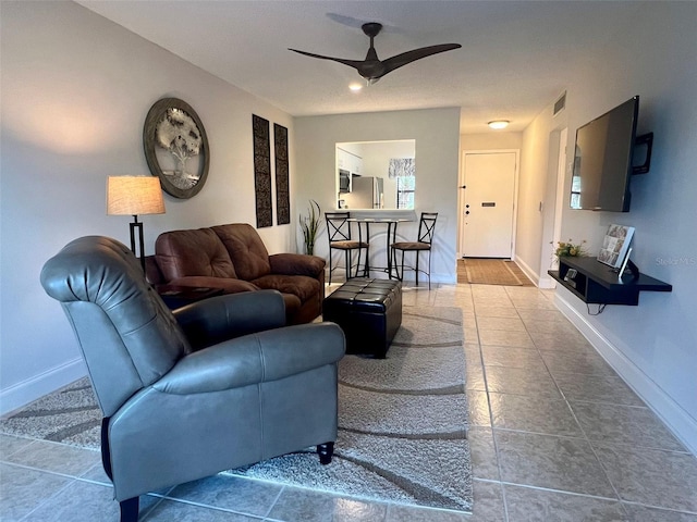1359 Mission Cir Unit 48A, Clearwater, FL 33759 - living room with ceiling fan and tile patterned flooring
