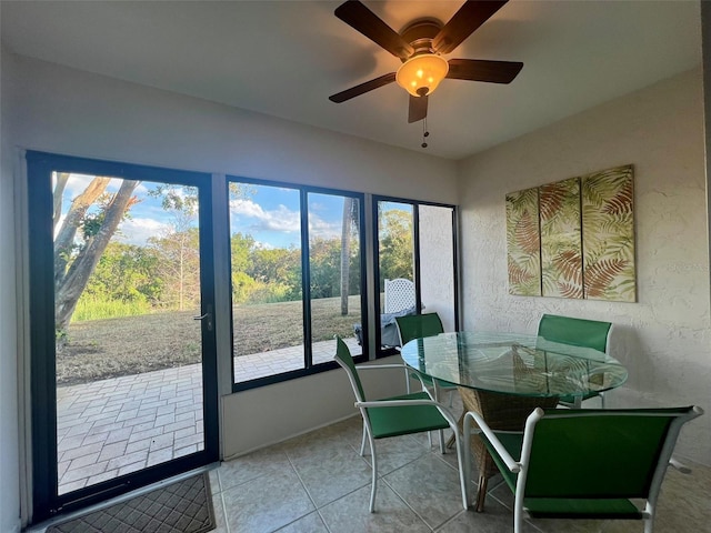 1359 Mission Cir Unit 48A, Clearwater, FL 33759 - dining area with a ceiling fan and tile patterned flooring
