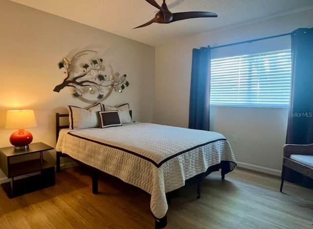 1359 Mission Cir Unit 48A, Clearwater, FL 33759 - bedroom with wood finished floors, a ceiling fan, and vaulted ceiling