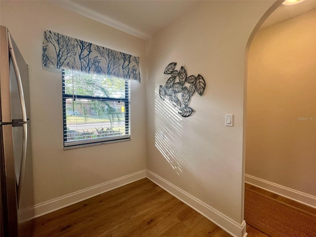 1359 Mission Cir Unit 48A, Clearwater, FL 33759 - detailed view of arched walkways, freestanding refrigerator, and wood finished floors