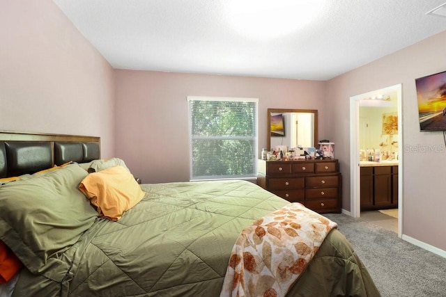 9826 Hound Chase Dr, Gibsonton, FL 33534 - bedroom with light carpet and ensuite bath