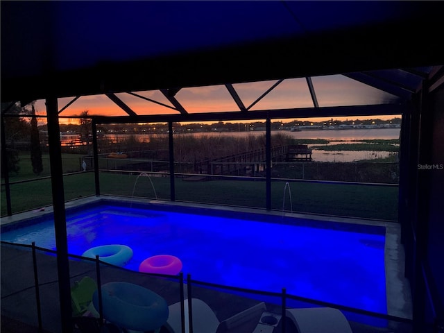 10866 Harborside Dr, Largo, FL 33773 - pool at dusk with a lanai and an outdoor pool