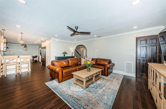 10866 Harborside Dr, Largo, FL 33773 - living room featuring a textured ceiling, dark wood-style flooring, a ceiling fan, recessed lighting, and ornamental molding