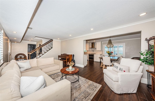 10866 Harborside Dr, Largo, FL 33773 - living room featuring stairway, dark wood-style floors, recessed lighting, and crown molding