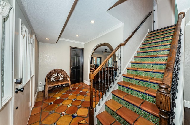 10866 Harborside Dr, Largo, FL 33773 - tiled foyer entrance featuring stairs, recessed lighting, ceiling fan, a textured ceiling, and ornamental molding