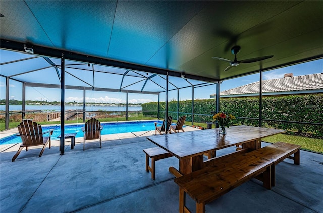 10866 Harborside Dr, Largo, FL 33773 - outdoor pool with a water view, a patio area, glass enclosure, and ceiling fan