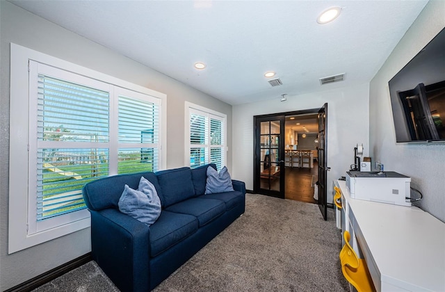 10866 Harborside Dr, Largo, FL 33773 - living room featuring carpet, recessed lighting, and french doors