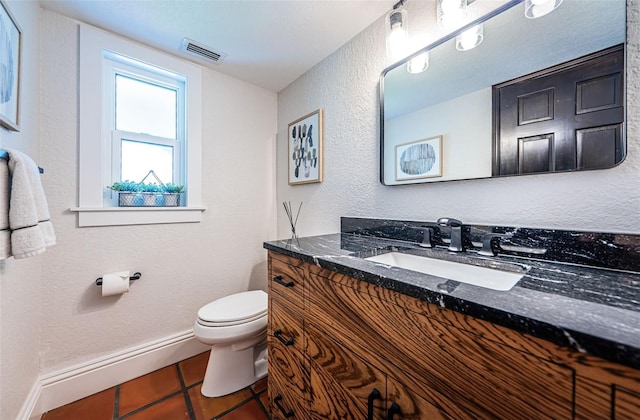 10866 Harborside Dr, Largo, FL 33773 - half bath with tile patterned flooring, vanity, and a textured wall