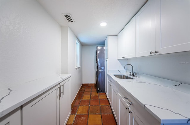 10866 Harborside Dr, Largo, FL 33773 - laundry area featuring recessed lighting and dark tile patterned flooring