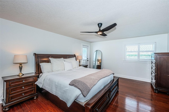 10866 Harborside Dr, Largo, FL 33773 - bedroom with dark wood finished floors, a textured ceiling, and ceiling fan