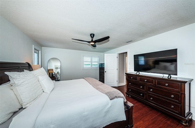 10866 Harborside Dr, Largo, FL 33773 - bedroom featuring dark wood finished floors, a ceiling fan, and a textured ceiling