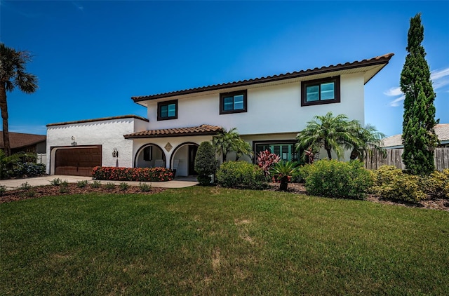 10866 Harborside Dr, Largo, FL 33773 - mediterranean / spanish house with stucco siding, driveway, and a garage