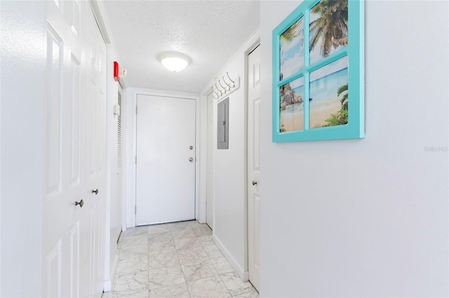1270 Gulf Blvd Unit 1605, Clearwater Beach, FL 33767 - corridor with light marble finish floors, a textured ceiling, and electric panel
