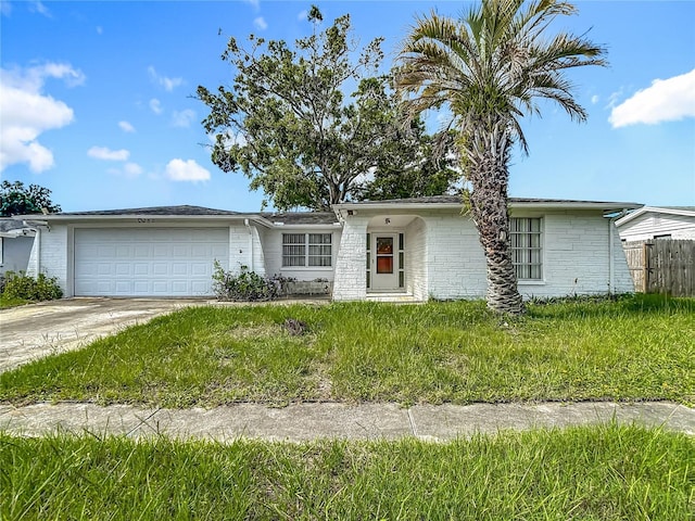 6250 7th Ave, New Port Richey, FL 34653 - view of front of property featuring a garage and concrete driveway
