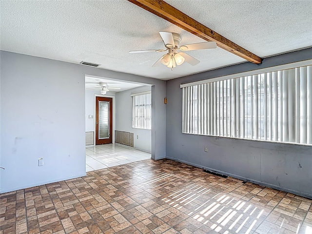 6250 7th Ave, New Port Richey, FL 34653 - empty room with a ceiling fan, brick patterned floors, and a textured ceiling