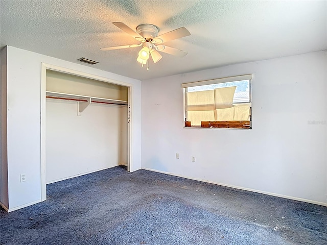6250 7th Ave, New Port Richey, FL 34653 - unfurnished bedroom with a closet, a textured ceiling, and ceiling fan