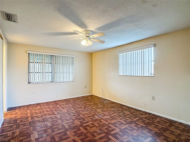 6250 7th Ave, New Port Richey, FL 34653 - spare room featuring ceiling fan and a textured ceiling